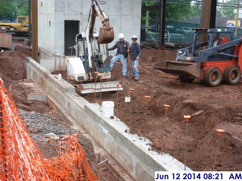 Backfilling and compacting along foundation walls at column line 6.5 (G-D) Facing East (800x600)